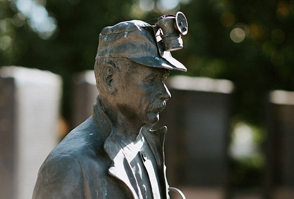 A copper statue of a miner represents the rich mining history of Pittsburg, Kansas.
