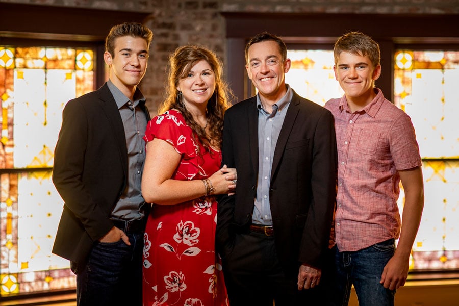 Four family members standing for a photo