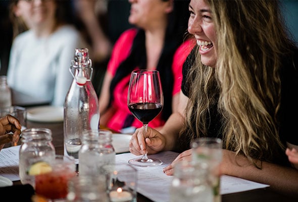 woman in restaurant wine laughter