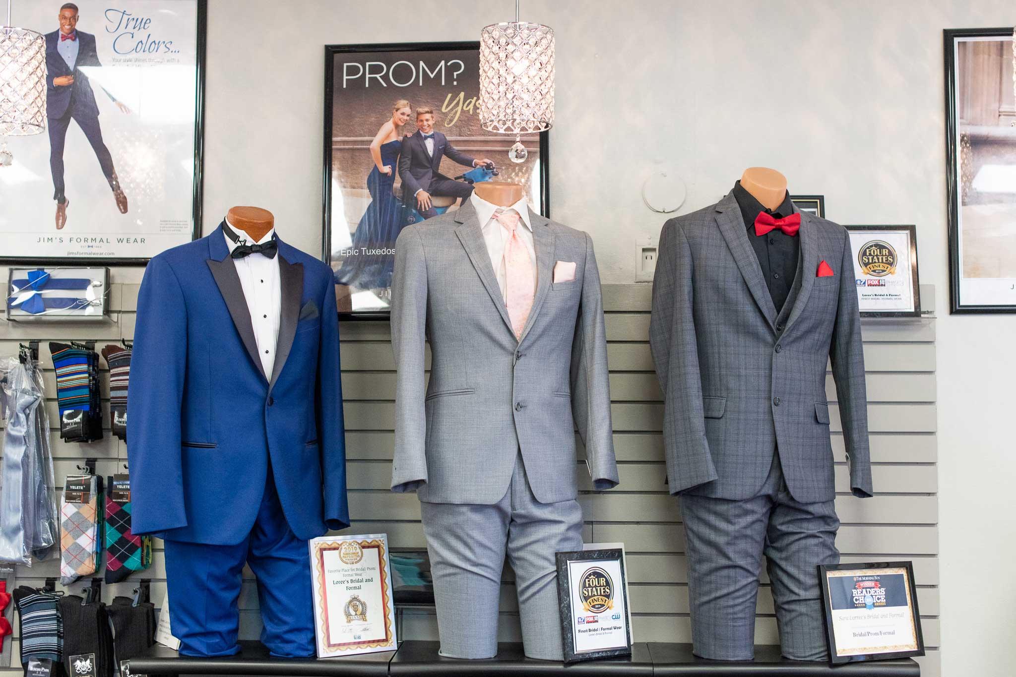 Suits lined up along a wall